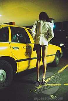 Prostitute Standing by Taxi